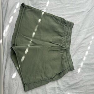These high-waisted green H&M shorts are in good condition.